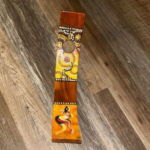 hand-painted wooden wine bottle holder featuring Australian Aboriginal dot art.